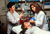 Emergency treatment: trauma team & female patient