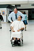 Hospital porter pushing a patient