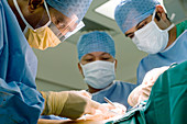 Surgeons operating