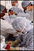 Surgeons perform quadruple bypass heart operation