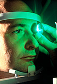 Examination of a man's eye before surgery