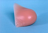 Breast prosthesis,used as a surgical implant