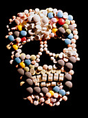 Assorted pills depicting a human skull