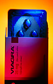 Box of blue Viagra pills in bubble packaging