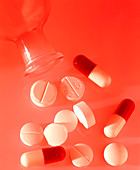 Assortment of pain killing pills with glass bottle