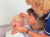 Four-year-old boy receiving polio vaccination