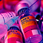 Assorted bottles of MMR vaccine and a syringe