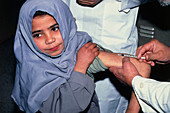 Girl receiving a leishmaniasis vaccine