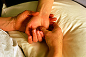 Woman's hand and wrist receiving massage