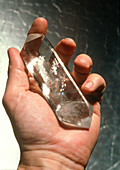 Crystal therapy: rock crystal in man's hand
