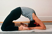 Woman performing a yoga exercise