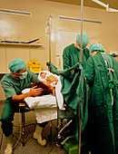 Mum holding her baby after a caesarean section