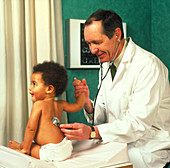 GP checks child's chest with stethoscope