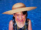 Smiling young girl wearing coloured sunblock