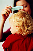 Combing child's hair