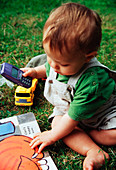 Baby playing with mobile phone