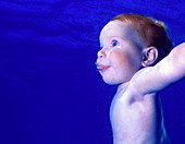 Baby swimming underwater