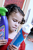 Young girl with cleaning products