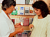 Nurse advising patient on use of contraceptives