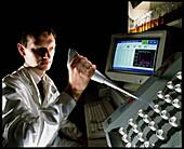 Scientist using an automatic culture counter