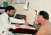 Doctor and patient consultation regarding cataract