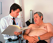 Doctor in consultation with an obese man