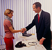 Teenage girl shakes hand with her GP doctor