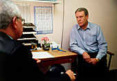 Doctor in consultation with a middle-aged man