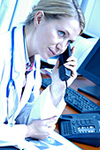Doctor talking on a telephone