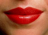 Close-up of the red lips of a woman (front view)
