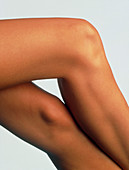 Side view of the crossed legs of a woman