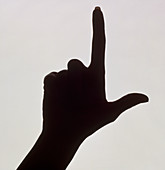 Silhouette of a hand with index finger pointing