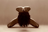 Naked woman bowing