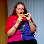 Adolescent girl eating a waffle