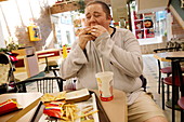 Obese man eating