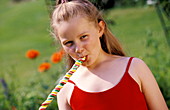 Young girl eating lolly