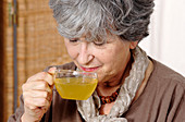 Woman drinking herb tea