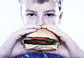 Boy eating a burger