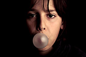 Boy blowing bubblegum