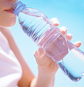Teenage girl drinking water
