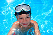 Young boy in a swimming pool