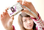Woman taking a photograph of herself