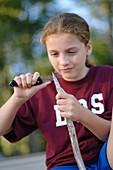 Girl whittling a stick