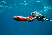 Scuba diver using a DPV