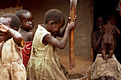 Making maize flour,Uganda