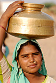 Girl carrying water