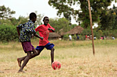 Boys playing football,Uganda