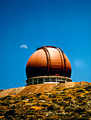 Moon over unfinished WHT telescope dome,La Palma