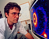 Scientist with image from Hubble Space Telescope