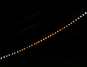 Time-lapse photograph of a partial lunar eclipse